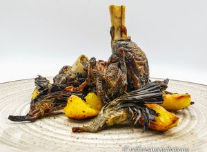 Foto di Capretto arrosto al forno con carciofi e patate