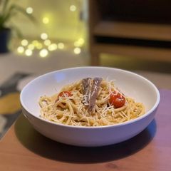 A picture of Anchovy and tomato bucatini pasta.