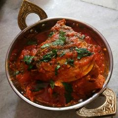 A picture of Fish head tomato gravy.