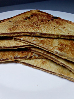 A picture of Fried plantain and chocolate bread sandwich.