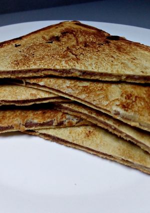 A picture of Fried plantain and chocolate bread sandwich.