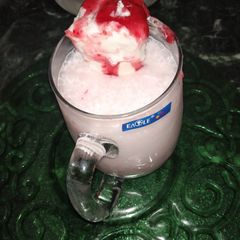 A picture of Strawberry shake with ice cream.