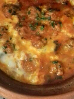 A picture of Kefta Tagine with Tomatoes and Eggs.