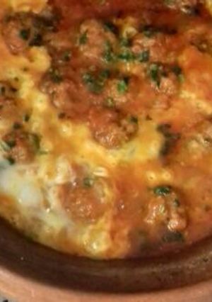 A picture of Kefta Tagine with Tomatoes and Eggs.