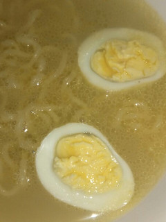A picture of Chicken noodle soup with egg.