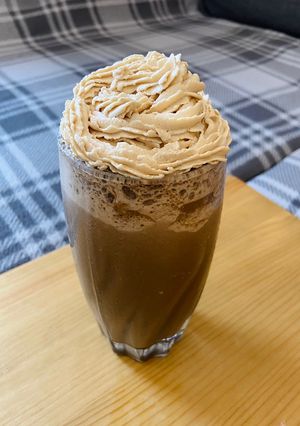 A picture of Mocha Cookie Frozen Coffee with Coffee Whipped Cream.