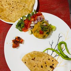 Masoor Dal Bharta with North Indian Style Chapati and Chatpata Mango Pickle A picture of Masoor Dal Bharta with North Indian Style Chapati and Chatpata Mango Pickle.