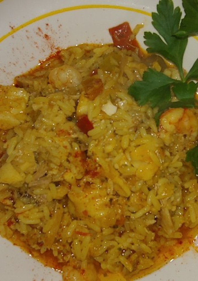 Una foto de Arròs melos con bacallà, lechona i Gambón