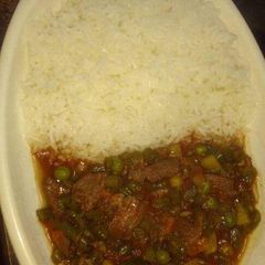 A picture of Rice with Beef stew.