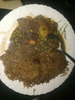 A picture of Pilau with beef stew.