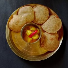 A picture of No onion garlic Aloo Sabji & Sattu Kachori.