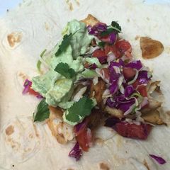 A picture of Fish tacos with avocado lime sauce.