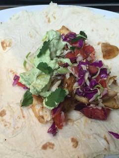 A picture of Fish tacos with avocado lime sauce.
