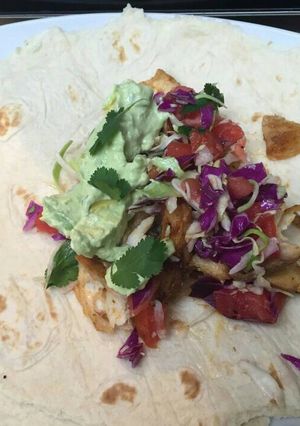 A picture of Fish tacos with avocado lime sauce.