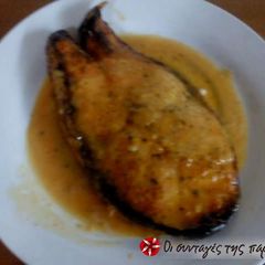 A picture of Grilled salmon with a dressing.