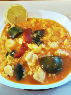 Una foto de Arroz con bacalao y kokotxas de rape