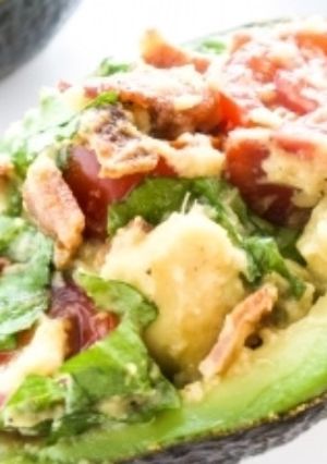 A picture of BLT stuffed avocado.