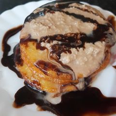 A picture of Malpua with chocolate rabri.