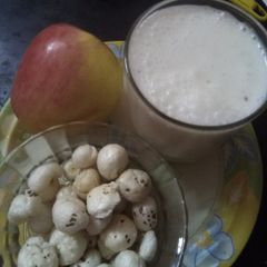 A picture of Roasted nuts (makana phool) with apple and skimmed milk.