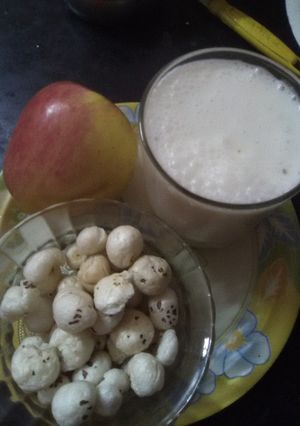 A picture of Roasted nuts (makana phool) with apple and skimmed milk.