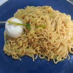A picture of Noddles with spring onion and egg.