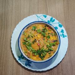 A picture of Vegetable Broken Wheat (Dalia) Khichdi.