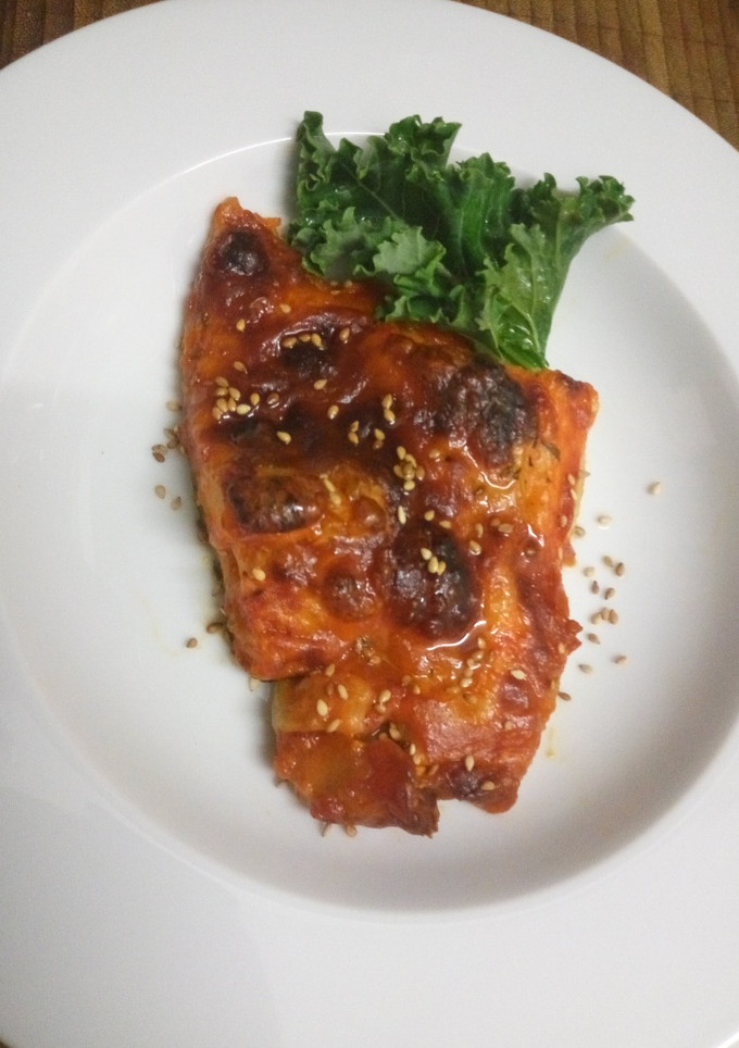 Una foto de Bacalao con tomate y mozzarella