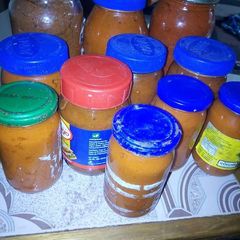 A picture of Bottled tomatoes and pepper.