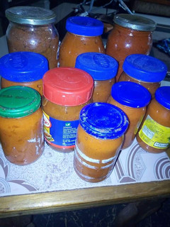 A picture of Bottled tomatoes and pepper.