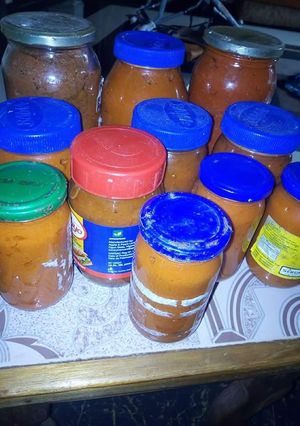 A picture of Bottled tomatoes and pepper.