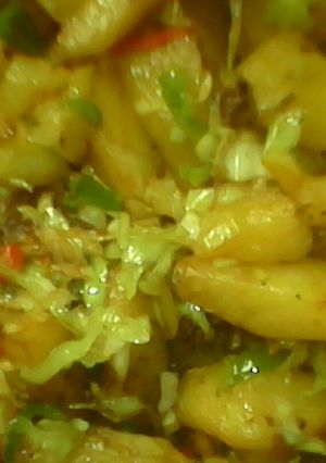A picture of Potatoes wit cabage sauce.