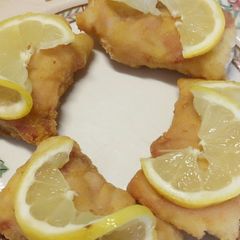A picture of Deep fried bacon wrapped cod.
