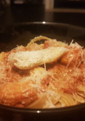 A picture of Orange Sauce Fettuccine, with Fish & Veg.