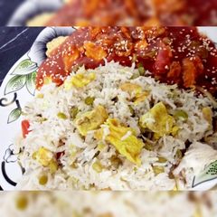 A picture of Egg fried rice with Dragon Chicken😋.