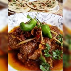 A picture of Bhuna mutton with nan.