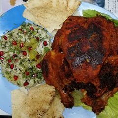 A picture of Chicken tandoori with moutabel(spicy eggplant dip).