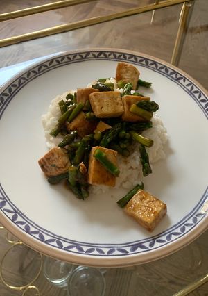 A picture of Tofu and Asparagus in Teriyaki sauce.
