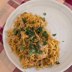 A picture of Chicken biriyani in pressure cooker.