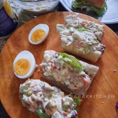 A picture of Coleslaw Sandwich with Eggs.
