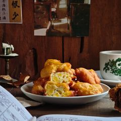 A picture of 139. Golden Banana Fritters with Honey & Sesame.