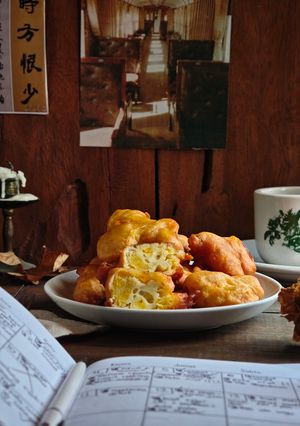 A picture of 139. Golden Banana Fritters with Honey & Sesame.