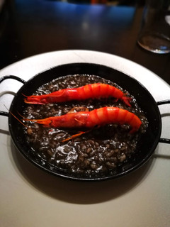 Una foto de Arroz cremoso negro de sepia
