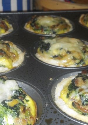 A picture of Swiss, bacon and spinach mini quiches.