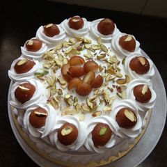 A picture of Gulab jamun cake.