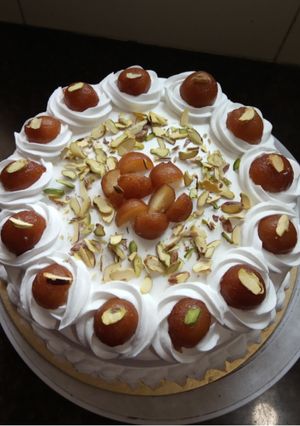 A picture of Gulab jamun cake.