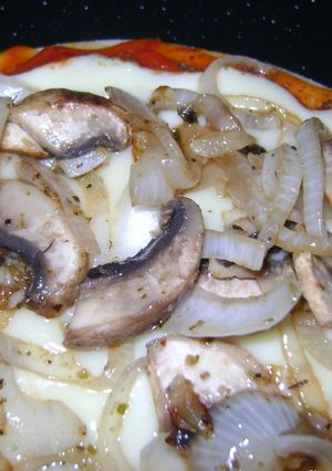 Una foto de Pizza con champiñones salteados