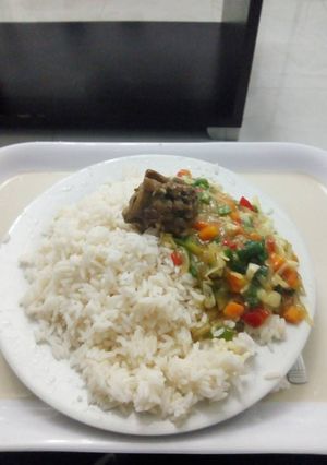 A picture of White rice with curry sauce.