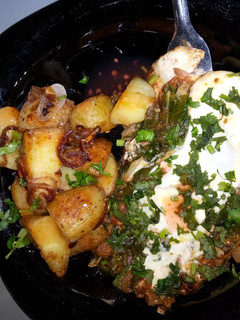 A picture of Sauted potatoes and eggs.