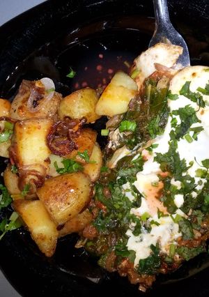 A picture of Sauted potatoes and eggs.