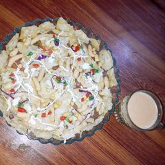 A picture of Potato bhaji with çrispy papad.
